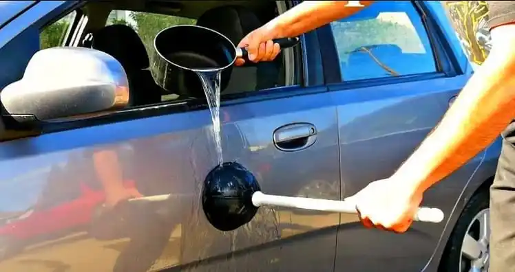 fixing-a-dent-with-hot-water-a-plunge-jpg